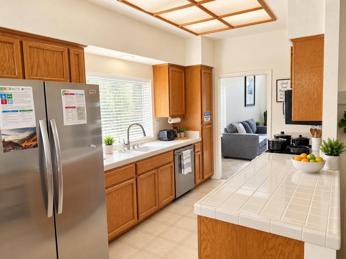 The kitchen, with wooden cabinets and a window over the sink